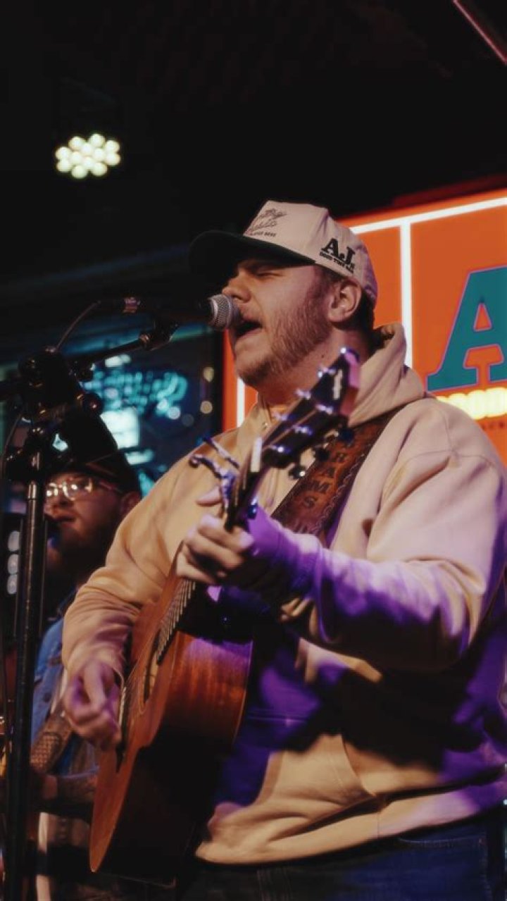 Sitting here just drinking beer lyrics